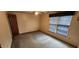 Bedroom featuring carpet, window, and door at 201 Providence Rd, Oxford, NC 27565