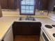 Bright kitchen features double sink, ample counter space, and updated appliances at 201 Providence Rd, Oxford, NC 27565