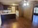 Kitchen with dark brown cabinets and laundry area at 201 Providence Rd, Oxford, NC 27565