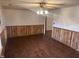 Living room with wood-look floors and wood paneling at 201 Providence Rd, Oxford, NC 27565