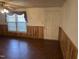 Living room with wood-look floors and wood paneling at 201 Providence Rd, Oxford, NC 27565