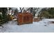 Rustic metal storage shed in snowy backyard at 201 Providence Rd, Oxford, NC 27565