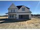 Two-story house with a front-facing garage and covered porch at 253 Trescott St, Smithfield, NC 27577