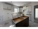 Modern kitchen featuring white cabinets and an island at 253 Trescott St, Smithfield, NC 27577