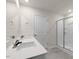 Modern bathroom with double vanity and a large shower at 2557 Summersby Dr, Mebane, NC 27302
