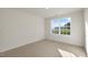 Bright bedroom with a large window overlooking a yard at 2557 Summersby Dr, Mebane, NC 27302