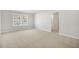 Spacious bedroom with a window, carpet, and access to a bathroom at 2557 Summersby Dr, Mebane, NC 27302