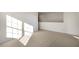 Sunlit bedroom with high ceilings and ample space at 2557 Summersby Dr, Mebane, NC 27302