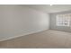 Bright bedroom with carpet and large window at 2557 Summersby Dr, Mebane, NC 27302