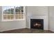 Modern gas fireplace with white mantel at 2557 Summersby Dr, Mebane, NC 27302