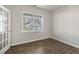 Bright home office with wood-look floors and a large window at 2557 Summersby Dr, Mebane, NC 27302