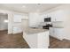Modern kitchen with white cabinets, granite countertops and stainless steel appliances at 2557 Summersby Dr, Mebane, NC 27302