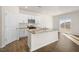 Modern kitchen with white cabinets, granite counters, and an island at 2557 Summersby Dr, Mebane, NC 27302