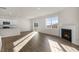 Open concept kitchen and living area with fireplace and patio door at 2557 Summersby Dr, Mebane, NC 27302