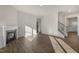 Living area with hardwood floors, fireplace, and staircase at 2557 Summersby Dr, Mebane, NC 27302
