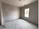 Unfinished bedroom with window offers a blank canvas ready for personalization and design at 282 Trescott St, Smithfield, NC 27577