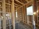 Framed walls and window openings in an unfinished room at 282 Trescott St, Smithfield, NC 27577