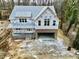 Aerial view of a new home under construction; brick exterior, two-story design, and attached garage at 301 W College St, Louisburg, NC 27549