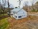 Aerial view of the house's rear, highlighting its two-story design and exterior features at 301 W College St, Louisburg, NC 27549