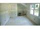 Spacious bedroom featuring ample natural light and neutral walls, perfect for relaxation and personalization at 301 W College St, Louisburg, NC 27549