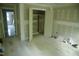 Bedroom with closet and open doorway and bright windows at 301 W College St, Louisburg, NC 27549
