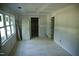 Bright bedroom with closet space and large windows, creating a welcoming and comfortable atmosphere at 301 W College St, Louisburg, NC 27549