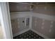 A laundry room showcasing stylish flooring and practical shelving at 301 W College St, Louisburg, NC 27549
