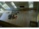 Bright living room with hardwood floors and large windows, bathed in natural light at 301 W College St, Louisburg, NC 27549