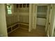 Functional mudroom with bench seating, storage cubbies, and a doorway to another room at 301 W College St, Louisburg, NC 27549