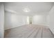 Large bedroom with gray carpet and access to a hallway at 3720 Massey Pond Trl # Leighton, Raleigh, NC 27616