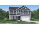 Two-story house with gray siding, white garage door, and landscaped lawn at 3720 Massey Pond Trl, Raleigh, NC 27616