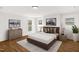 Primary bedroom with hardwood floors and stylish decor at 507 Price Ave, Durham, NC 27701