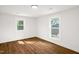 Bright bedroom with hardwood floors and large windows at 507 Price Ave, Durham, NC 27701