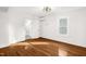 Bedroom with hardwood floors and a view of the bathroom at 507 Price Ave, Durham, NC 27701