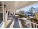 Spacious front porch offering a view of the tree-lined street at 507 Price Ave, Durham, NC 27701