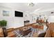 Open living room with hardwood floors and staged furniture at 507 Price Ave, Durham, NC 27701