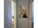 The doorway opens to a view of the modern bathroom's bathtub and shower at 54 Cottage Way Way, Pittsboro, NC 27312