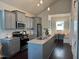 Bright and spacious kitchen boasts stainless steel appliances, granite countertops, and an open layout at 54 Cottage Way Way, Pittsboro, NC 27312