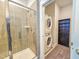 This laundry room has stacked washer and dryer units, and a tiled shower at 54 Cottage Way Way, Pittsboro, NC 27312