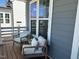 Cozy porch featuring cushioned chairs, providing a relaxing outdoor space to enjoy the view from the home at 54 Cottage Way Way, Pittsboro, NC 27312