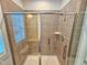 The shower is fitted with modern fixtures and a glass sliding door at 54 Cottage Way Way, Pittsboro, NC 27312