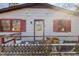 Close up of the front entrance of a ranch home with red shutters at 602 E Club Blvd, Durham, NC 27704