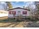 Front view of a ranch home with red shutters and deck at 602 E Club Blvd, Durham, NC 27704