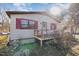 Side view of a ranch home with red shutters and deck at 602 E Club Blvd, Durham, NC 27704