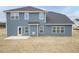 The backyard features newly installed siding and a blank plot ready for customization at 62 Faircox Way # 139, Garner, NC 27529