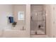 Relaxing bathroom with a soaking tub and separate glass-enclosed shower at 62 Faircox Way # 139, Garner, NC 27529