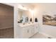 Modern bathroom features double vanity with white cabinets and a large mirror at 62 Faircox Way # 139, Garner, NC 27529