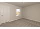 This bedroom features a window that provides natural light and carpeted floors at 62 Faircox Way # 139, Garner, NC 27529