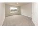 This bedroom features a window that provides natural light and carpeted floors at 62 Faircox Way # 139, Garner, NC 27529