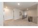 Bright hallway features neutral decor, carpet flooring, and wrought iron railing at 62 Faircox Way # 139, Garner, NC 27529